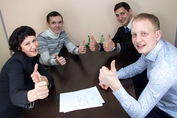 Üzletasszony és három boldog munkavállalók — Stock Fotó