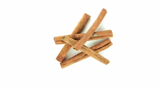 Stick cinnamon, randomly on white background — Stock Video