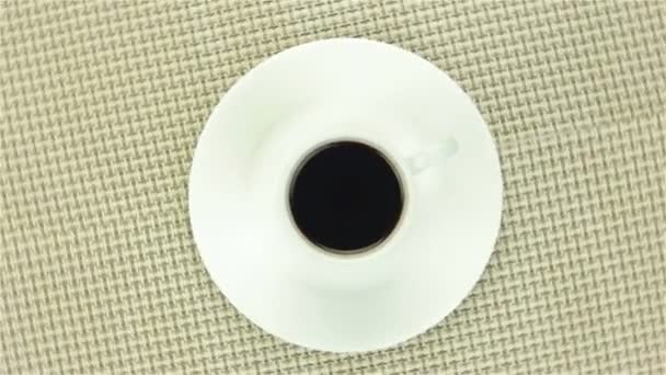 Cup of instant coffee on colour napkin — Stock Video
