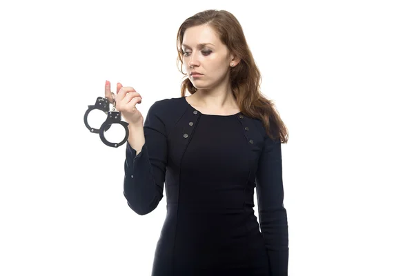 Thinking woman with handcuffs — Stock Photo, Image