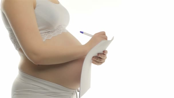 Těhotná žena, poznámky — Stock video