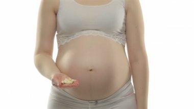 Hamile kadın gösteren vitaminler