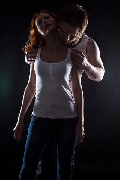 Woman with red hair and strong man — Stock Photo, Image