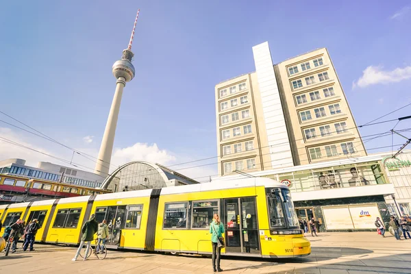BERLIN, GERMANY - 4 MARCH 2016: metro tram bus at Alexanderplatz in central Mitte district of european capital city with televison tower known as  " Fernsehturm " on background - Wide angle distortion — Stock Photo, Image