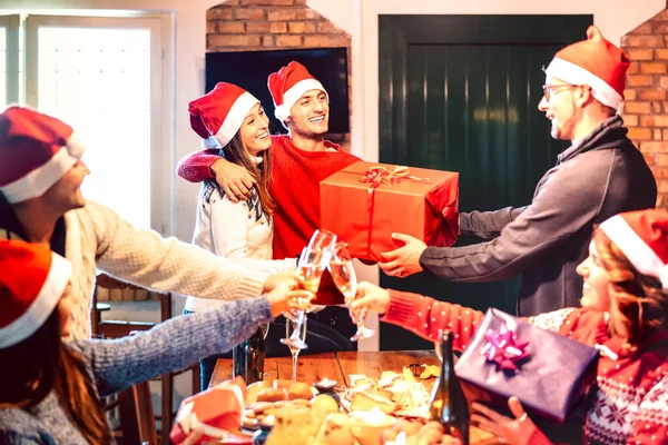 Friends Santa Hat Giving Each Other Christmas Present Champagne Wine — Stock Photo, Image