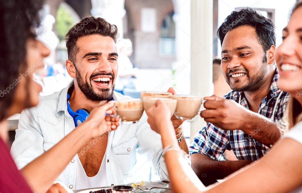 People group drinking latte at coffee bar restaurant - Happy friends talking and having fun together at cafeteria dehors - Life style concept with happy men and women at cafe - Focus on left guy