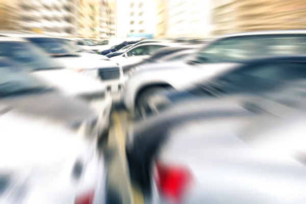 Modern cars at parking lot of company retail store - Concept of transportation and rental service with full optional insurance - Radial zoom defocusing — Stock Photo, Image