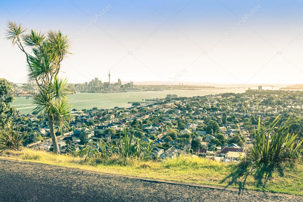 Amazing view of Auckland skyline and territory from Mount Victoria in Devonport area - High angle sight of the New Zealand capital - Vintage filtered look with low sun out of the right side of image