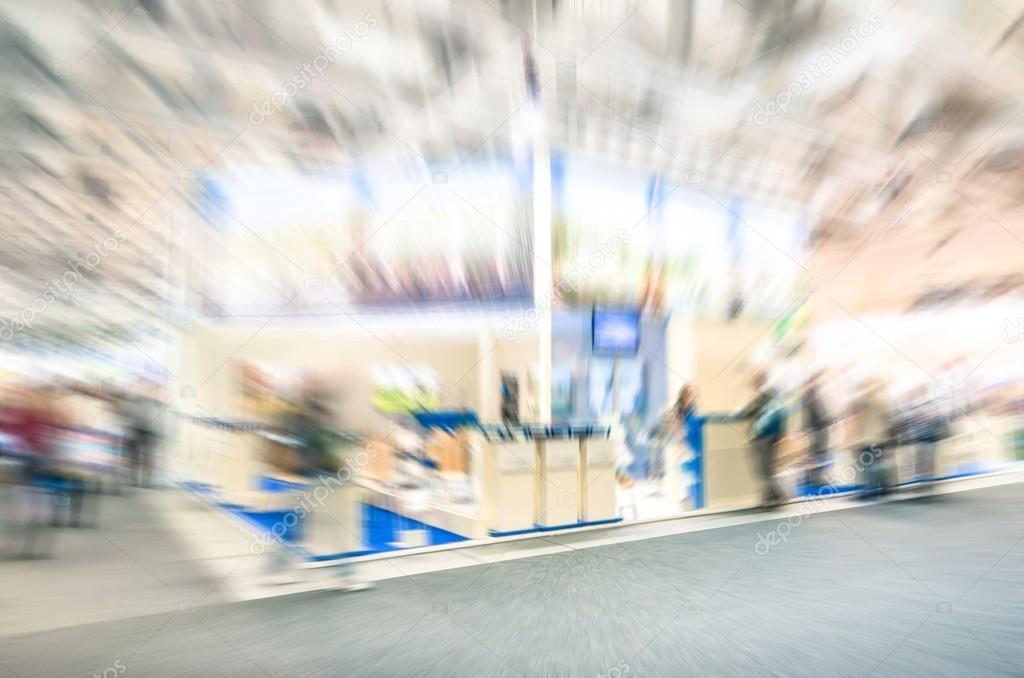 Generic trade show expo stand with neutral blurred zoom defocusing - Concept of business social gathering for international tradeshow meeting exchange - Overexposed desaturated filter