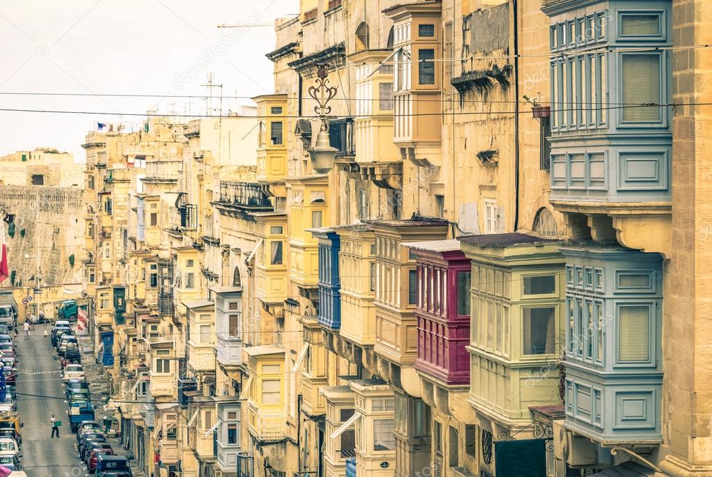 Typical buildings and balconies in La Valletta capital of mediterranean island of Malta - Vintage filtered look