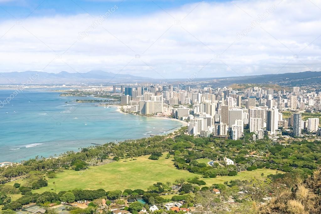 Panorama skyline view of Honolulu city and Waikiki beach in the pacific island of Oahu in Hawaii - Postcard from Diamond Head crater of exclusive travel destination - Sunny afternoon color tones