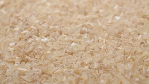 Wheat grit close-up. Solid wheat varieties. Wheat porridge. — Stock Video