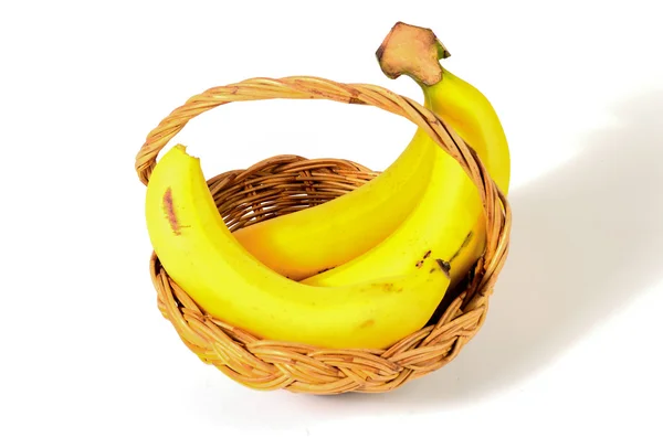 Bananas in basket isolated on white background — Stock Photo, Image
