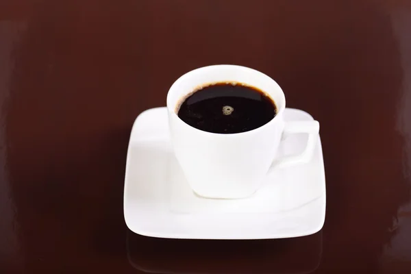 Taza de café y platillo en el fondo — Foto de Stock