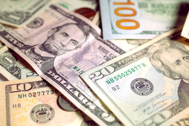United States dollar bills with a cent coins. Close up photography. Finance and Economy concept.