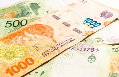 Peso banknotes of the money of the argetine currency, the Argentine peso. Close up photo. Economy and finance concept.