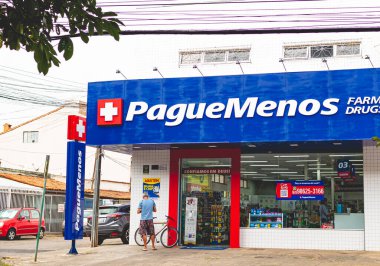 Brasilia, Federal District - Brazil. December, 07, 2020, street sign of Pague Menos, is always close to bringing health to all Brazilians