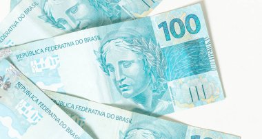 Real, money from Brazil. Dinheiro, Reais, Real Brasileiro, Brasil. Brazilian banknotes in close-up.  brazilian banknotes of 100 Reais  