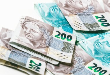 Real, money from Brazil. Dinheiro, Reais, Real Brasileiro, Brasil. Brazilian banknotes in close-up.  brazilian banknotes of 200 and 100 Reais  