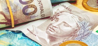 Real money from brazil. Reais, Brazil, Money. A group of brazilian banknotes on a desk.