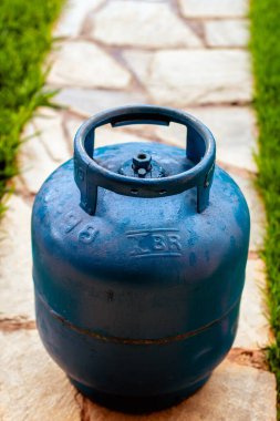 The kitchen gas cylinder was placed on the floor.
