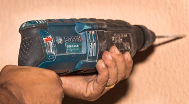 Brazil, Federal District - Brazil. December, 27, 2019. Photo of a Bosch model GBH 2-24 electric drill 'martele perfurador' held by a man.