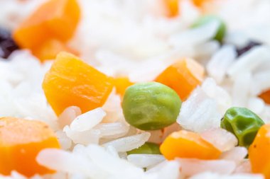 close-up view of delicious rice with vegetables in glass bowl