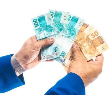 Gerçek para, Brezilya 'dan gelen para. Brasil, Dinheiro, Reais, Hand. Elinde Brezilya banknotları tutan insanlar..