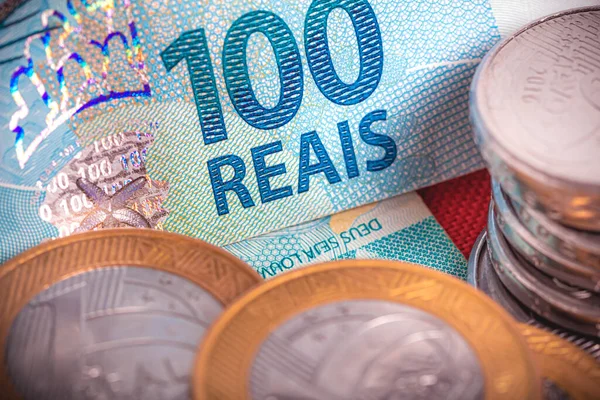 Real coins and Brazilian real banknotes on the table, Investment and economy concept