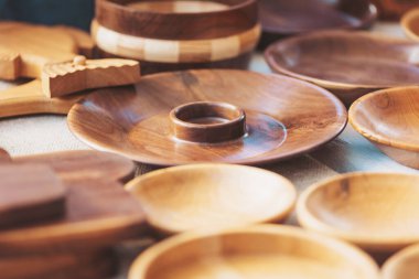 Beautiful handcrafted wooden bowls and decorative pieces displayed at an artisan market showcasing traditional craftsmanship and natural materials
