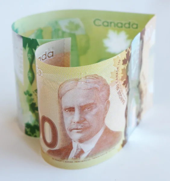 Канадские деньги любят нас Лицензионные Стоковые Фото