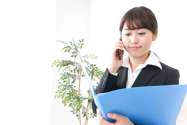 Young Businesswoman Informing Boss Stock Photo