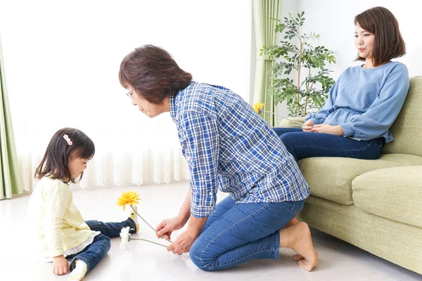 Child Giving Grandmother Flower — Stock Photo, Image