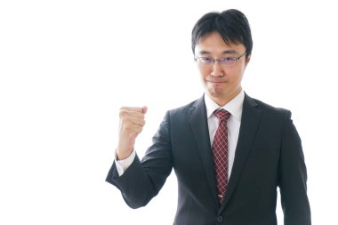 Genç işadamı yumruğunu kaldırıyor