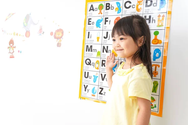 Children learning English in class