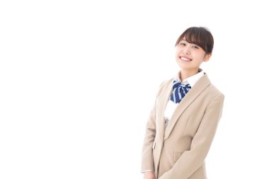 Gülümseyen Asyalı bir kız öğrenci. 