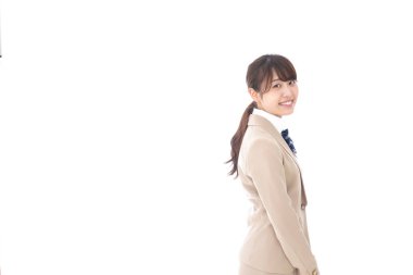 Gülümseyen Asyalı bir kız öğrenci. 