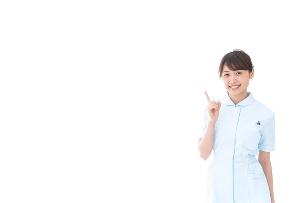 Asian Nurse Giving Advice Holding Finger — Stock Photo, Image