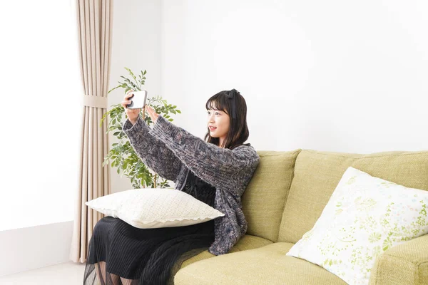 Young Woman Having Video Call Home — Stock Photo, Image