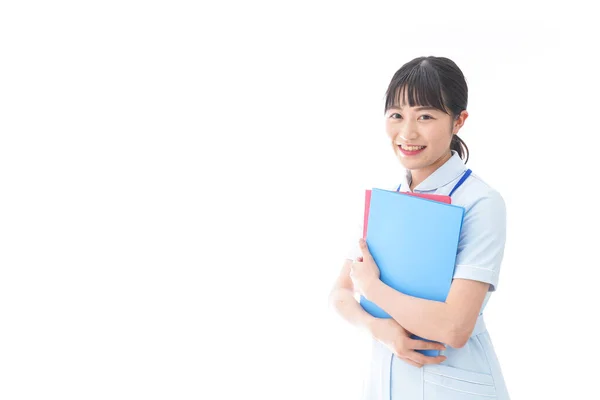 Jovem Enfermeira Trabalho Segundo Plano — Fotografia de Stock