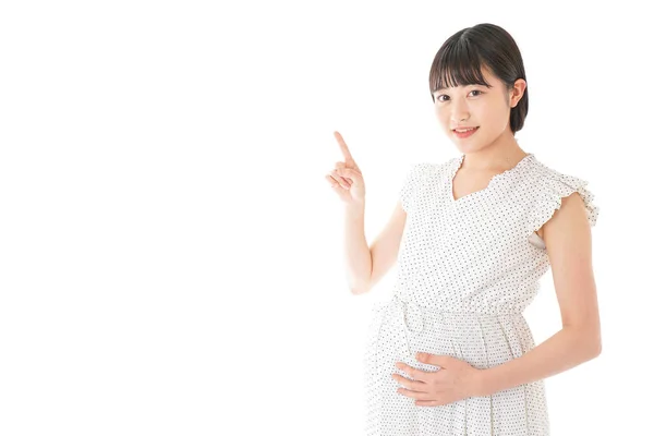 背景に立つ妊婦 — ストック写真