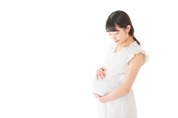 背景に立つ妊婦 — ストック写真