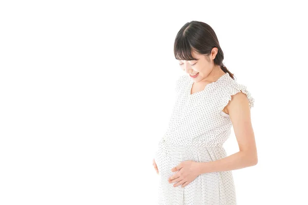 背景に立つ妊婦 — ストック写真