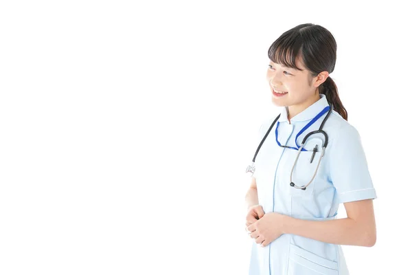 Junge Krankenschwester Uniform Auf Weißem Hintergrund — Stockfoto