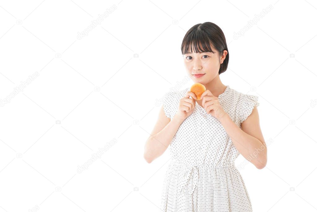 Young woman eating bread