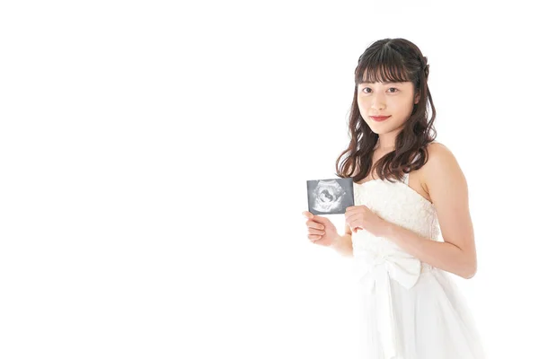 결혼식 의상을 임신부가 아기에게 초음파 검사를 — 스톡 사진