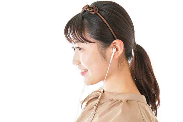 Mujer Joven Escuchando Música Auriculares Sobre Fondo Blanco — Foto de Stock