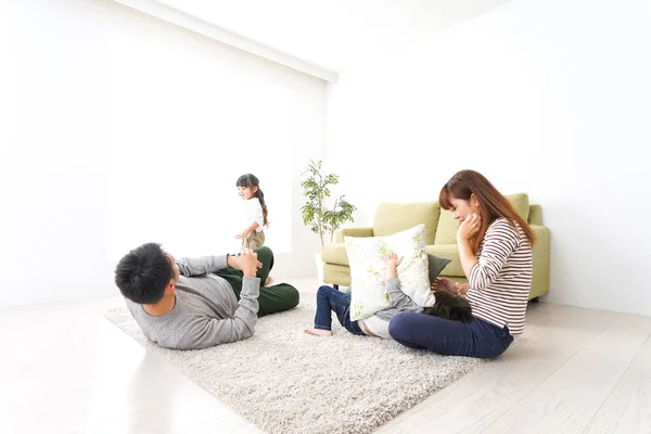 Happy Young Family Playing Home — Stock Photo, Image