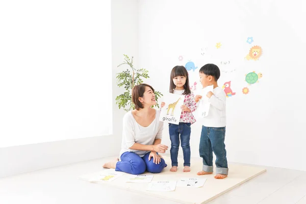 Children and teacher at Kindergarten, Preschool concept