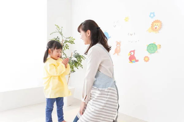 Nursery Teacher Girls — Stock Photo, Image